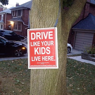 Drive like your kids live here sign